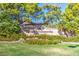 Sun City Summerlin entrance sign surrounded by lush landscaping and mature trees creates an inviting welcome at 8513 Glenmount Dr, Las Vegas, NV 89134