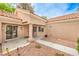 Home exterior features a covered porch with column, desert landscaping, and pathway leading to the front door at 8513 Glenmount Dr, Las Vegas, NV 89134