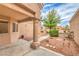 Home courtyard features desert landscaping, covered porch with column, and pathway leading to the entrance at 8513 Glenmount Dr, Las Vegas, NV 89134