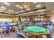Spacious game room featuring card tables with blue chairs providing a recreational space for friendly gatherings at 8513 Glenmount Dr, Las Vegas, NV 89134