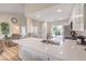 Modern kitchen boasts sleek white countertops, stainless steel appliances, and an inviting open layout at 8513 Glenmount Dr, Las Vegas, NV 89134