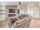 Living room with fireplace, wood floors, and ceiling fan at 8513 Glenmount Dr, Las Vegas, NV 89134
