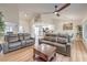 Spacious living room featuring an open-concept design with hardwood floors that connects to the kitchen at 8513 Glenmount Dr, Las Vegas, NV 89134