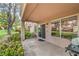 Charming covered patio with manicured lawn, providing a peaceful outdoor space at 8513 Glenmount Dr, Las Vegas, NV 89134