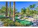 Enjoy the outdoors with this fun putting green surrounded by mature landscaping and palm trees at 8513 Glenmount Dr, Las Vegas, NV 89134