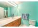 En-suite bathroom with an extended vanity, a large mirror, and a glass-enclosed shower at 8861 Hampton Green Ave, Las Vegas, NV 89129