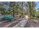 Community park featuring lush greenery, mature trees, picnic tables, and walking paths at 8861 Hampton Green Ave, Las Vegas, NV 89129