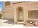 Inviting front entrance showcasing well-manicured landscaping and two car garage at 8861 Hampton Green Ave, Las Vegas, NV 89129