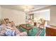 Comfortable upper-level sitting room featuring a floral sofa and a view of the first floor at 8861 Hampton Green Ave, Las Vegas, NV 89129