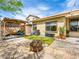 Backyard with a built in pergola, patio and lush artificial grass at 9037 Picket Fence Ave, Las Vegas, NV 89143
