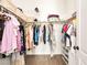 Walk-in closet with well-organized hanging clothes and shelves for optimal storage at 9037 Picket Fence Ave, Las Vegas, NV 89143
