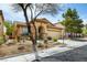 Inviting single-story home featuring desert landscaping and a charming front entrance at 9037 Picket Fence Ave, Las Vegas, NV 89143