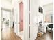 Hallway with an office setup, including desk, chair, and mounted TV at 9037 Picket Fence Ave, Las Vegas, NV 89143