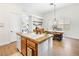 Bright kitchen features granite counters, white cabinetry, stainless appliances, and a breakfast bar at 9037 Picket Fence Ave, Las Vegas, NV 89143