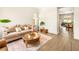 Cozy living room featuring warm tones and comfortable seating arrangements at 9037 Picket Fence Ave, Las Vegas, NV 89143