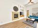 Cozy living room features a fireplace, built-in shelving, and a comfortable blue sofa at 9037 Picket Fence Ave, Las Vegas, NV 89143