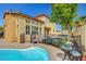 Spacious backyard with a pool, patio, and lush greenery, perfect for outdoor entertaining at 9413 Artesian Oak Ct, Las Vegas, NV 89149