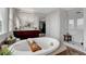 A luxurious bathroom with a soaking tub, a glass shower, and vanity, perfect for relaxation and pampering at 9413 Artesian Oak Ct, Las Vegas, NV 89149
