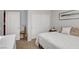A bright bedroom with white walls and trim, and tan carpet at 9413 Artesian Oak Ct, Las Vegas, NV 89149