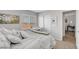 Cozy bedroom features a bed, a view to the neighborhood through the window and functional workspace at 9413 Artesian Oak Ct, Las Vegas, NV 89149