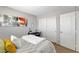 Bright bedroom features a bed, a functional workspace and stylish décor, creating a comfortable and inviting retreat at 9413 Artesian Oak Ct, Las Vegas, NV 89149