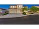 Charming two-story home with a tile roof, two-car garage, and landscaped front yard at 9413 Artesian Oak Ct, Las Vegas, NV 89149