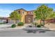 Charming two-story home with desert landscaping, stone accents, arched entry, and a two car garage at 9413 Artesian Oak Ct, Las Vegas, NV 89149