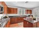 This kitchen features dark wood cabinets and granite counters at 9413 Artesian Oak Ct, Las Vegas, NV 89149