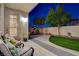 Inviting outdoor patio with comfortable seating and dining area, perfect for entertaining at 9413 Artesian Oak Ct, Las Vegas, NV 89149