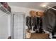 Organized walk-in closet with shelving and hanging storage, perfect for optimizing space and keeping belongings tidy at 9413 Artesian Oak Ct, Las Vegas, NV 89149