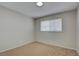 Bedroom with carpet flooring, a ceiling fan and a window providing natural light at 125 Sam Jonas Dr, Las Vegas, NV 89145