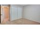 Bedroom with carpet flooring, a closet, and views of hallway at 125 Sam Jonas Dr, Las Vegas, NV 89145