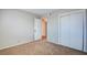 Bedroom with carpet, closet, and door leading to other rooms at 125 Sam Jonas Dr, Las Vegas, NV 89145