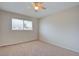 Bedroom featuring a ceiling fan and natural light from the large window at 125 Sam Jonas Dr, Las Vegas, NV 89145