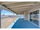 Wide covered patio with a painted floor, ideal for relaxation and enjoying the outdoor area at 125 Sam Jonas Dr, Las Vegas, NV 89145