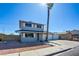 Inviting two-story home with a long driveway, a spacious two car garage, and low maintenance front yard at 125 Sam Jonas Dr, Las Vegas, NV 89145