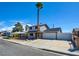 Two-story home with a long driveway and two car garage, complemented by a low maintenance front yard at 125 Sam Jonas Dr, Las Vegas, NV 89145
