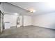 Clean garage space with washer, water heater, and overhead lighting at 125 Sam Jonas Dr, Las Vegas, NV 89145
