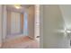 Hallway featuring carpet and access to storage and bathroom at 125 Sam Jonas Dr, Las Vegas, NV 89145