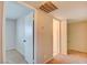 Hallway featuring neutral walls, carpet flooring, and access to different rooms at 125 Sam Jonas Dr, Las Vegas, NV 89145