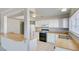 Well-lit kitchen with white cabinets, stainless steel sink, and modern appliances at 125 Sam Jonas Dr, Las Vegas, NV 89145
