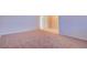 Spacious living room featuring neutral walls, plush carpet, and an open layout at 125 Sam Jonas Dr, Las Vegas, NV 89145