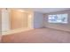 Inviting living room with neutral walls, plush carpet, and a bright window offering natural light at 125 Sam Jonas Dr, Las Vegas, NV 89145