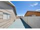 Side yard area with a painted concrete, showing potential for creative use of space at 125 Sam Jonas Dr, Las Vegas, NV 89145