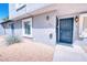 Charming townhouse with a secure front door and well maintained gravel landscaping and desert plants at 1326 N Jones Blvd, Las Vegas, NV 89108