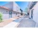 Condo exterior featuring a stucco facade, concrete pathway, and minimal desert landscaping at 1326 N Jones Blvd, Las Vegas, NV 89108