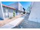 Condo exterior showing a stucco facade, concrete pathway, and minimal desert landscaping at 1326 N Jones Blvd, Las Vegas, NV 89108