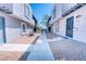 Cozy condo exterior with concrete pathway, neutral-colored stucco, and desert landscaping at 1326 N Jones Blvd, Las Vegas, NV 89108