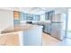 Modern kitchen features blue cabinets, stainless steel appliances, and granite countertops at 1326 N Jones Blvd, Las Vegas, NV 89108