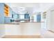 Bright kitchen featuring blue cabinets, granite countertops, and stainless steel appliances at 1326 N Jones Blvd, Las Vegas, NV 89108